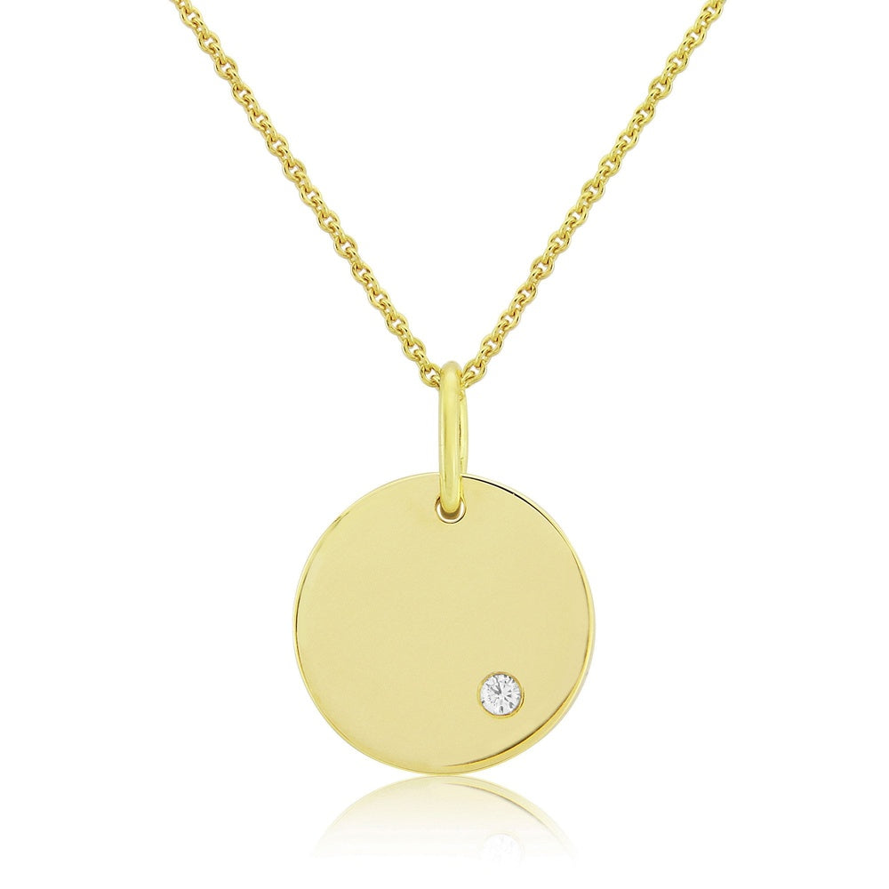 9CT SOLID GOLD DISC WITH ONE DIAMOND DETAIL.