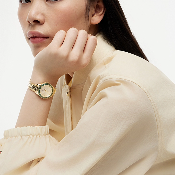 TOMMY HILFIGER GREEN BEZEL LADIES GOLD STAINLESS STEEL WATCH