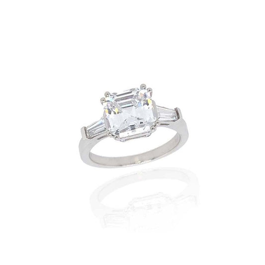 9CT WHITE GOLD RING WITH A PRINCESS CUT CUBIC ZIRCONIA CENTRE AND 2 CZ BAGUETTES  
