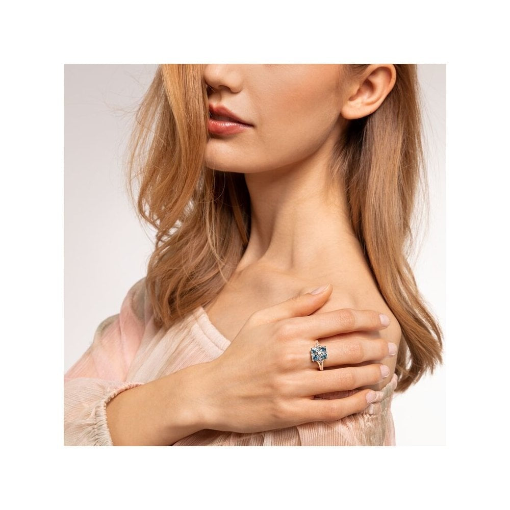 STERLING SILVER AQUAMARINE BLUE STONE RING WITH A SILVER CZ STAR ON IT & A CRESCENT & STAR ON EITHER SIDE OF IT