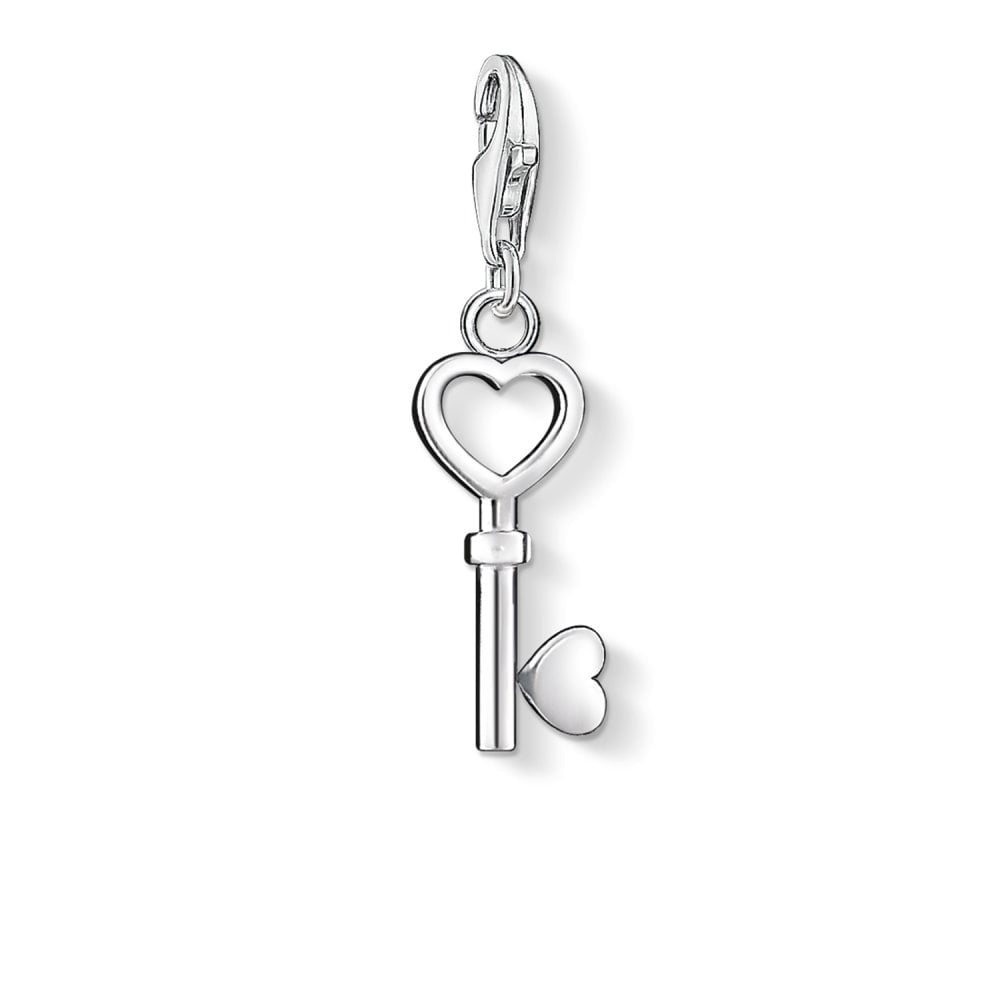 STERLING SILVER KEY CHARM PENDANT WITH SYMBOLIC HEATH SHAPED ELEMENTS