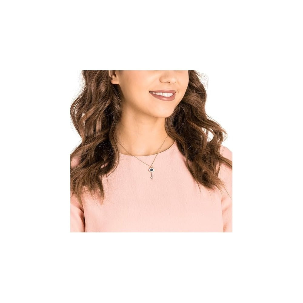 SWAROVSKI EVIL EYE AND KEY BLUE ROSE GOLD-TONE PLATED SYMBOLIC PENDANT