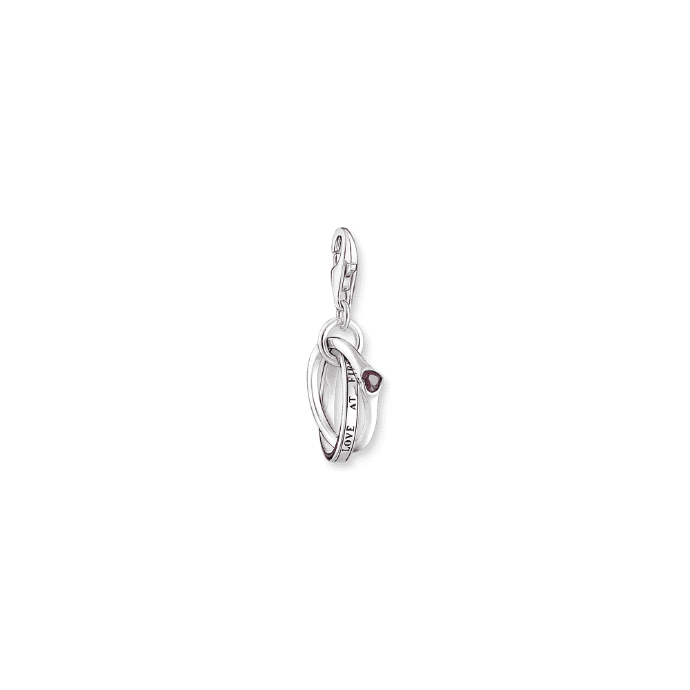 Silver charm pendant with two linked rings and a red stone 